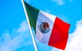 Mexican green white red flag with blue sky in Mexico Royalty Free Stock Photo