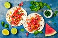 Mexican grilled chicken tacos with watermelon salsa.