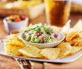 Mexican guacamole with tortilla chips and beer