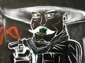 A mexican with a gun, graffiti