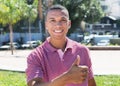 Mexican guy in the city showing thumb Royalty Free Stock Photo