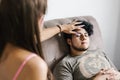 Mexican guy with closed eyes lying on the couch in regression therapy in Latin America Royalty Free Stock Photo