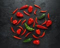 Mexican hot chili peppers colorful mix scotch bonnets habanero poblano serrano jalapeno on black background Royalty Free Stock Photo