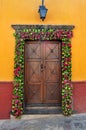 Mexican house Colonial style door with flowers decoration