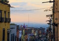 Multicolored Mexican Houses and Suspended Street Decorations at Sunset Royalty Free Stock Photo