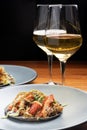 Mexican lobster taco in a black corn tortilla and a glass of white wine Royalty Free Stock Photo