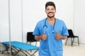 Mexican male doctor is ready for vacinating patients