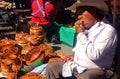 Mexican man eating in a market