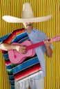 Mexican man serape poncho sombrero playing guitar Royalty Free Stock Photo