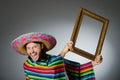 The mexican man with sombrero and picture frame Royalty Free Stock Photo