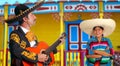 Mexican mariachi charro man and poncho Mexico girl Royalty Free Stock Photo