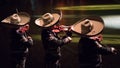 Mexican mariachis playing.