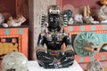 Mexican masks and obsidian statue in souvenir store Royalty Free Stock Photo