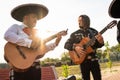 Mexican musician mariachi band on a city street.