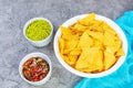 Mexican nachos with cheese. Corn chips with guacamole, salsa and tomato ketchup Royalty Free Stock Photo