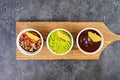 Mexican nachos with cheese. Corn chips with guacamole, salsa and tomato ketchup Royalty Free Stock Photo