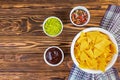 Mexican nachos with cheese. Corn chips with guacamole, salsa and tomato ketchup Royalty Free Stock Photo