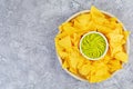 Mexican nachos with cheese. Corn chips with guacamole, salsa and tomato ketchup Royalty Free Stock Photo