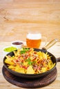 Mexican nachos with cheese. Corn chips with guacamole, salsa and tomato ketchup Royalty Free Stock Photo