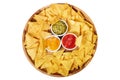 mexican nachos chips with guacamole, salsa and cheese dip on wooden plate isolated on white background Royalty Free Stock Photo