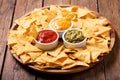 Mexican nachos corn chips with guacamole, salsa and cheese dip Royalty Free Stock Photo