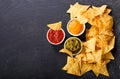 Mexican nachos corn chips with guacamole, salsa and cheese dip