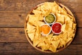 Mexican nachos corn chips with guacamole, salsa and cheese dip Royalty Free Stock Photo