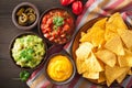 Mexican nachos tortilla chips with guacamole, salsa and cheese d Royalty Free Stock Photo