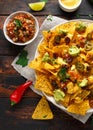 Mexican nachos tortilla chips with olives, jalapeno, guacamole, tomatoes salsa and cheese dip. Royalty Free Stock Photo