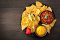 Mexican nachos tortilla chips with salsa and cheese dip Royalty Free Stock Photo