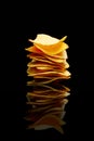 Mexican nachos tortilla chips stack, black background