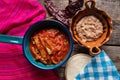 Mexican nopal cactus with guajillo red sauce on wooden background Royalty Free Stock Photo