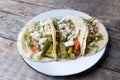 Mexican nopal cactus tacos with cheese on wooden background