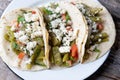 Mexican nopal cactus tacos with cheese on wooden background