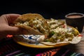 Mexican nopal cactus tacos with cheese on wooden background