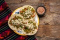 Mexican nopal cactus tacos with cheese on wooden background