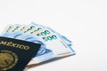 Mexican Passport and Five Hundred Peso Bills on white Background Royalty Free Stock Photo