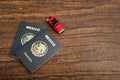 Mexican passports and small car on wooden table. Royalty Free Stock Photo