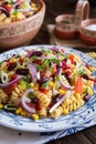 Mexican pasta salad with red bean, corn, tomato, onion and pepper Royalty Free Stock Photo