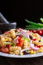 Mexican pasta salad with red bean, corn, tomato, onion and pepper Royalty Free Stock Photo