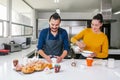 Mexican people baking and eating bread called pan de muerto traditional from Mexico in Halloween