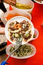 Mexican People eating tacos al pastor in Taqueria in Mexico