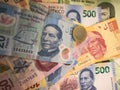 Mexican peso bills spread randomly over a flat surface Royalty Free Stock Photo