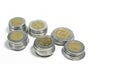 Mexican pesos, stacked coins of various denominations on white background Royalty Free Stock Photo