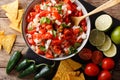 Mexican pico de gallo from tomatoes, onions, cilantro and jalapeno pepper close-up. horizontal top view Royalty Free Stock Photo