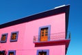 Mexican pink house facade wooden doors