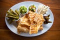 Mexican Pork rind. Nopales and guacamole. Mexican food on wooden background. Traditional Mexican food concept.