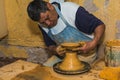 Mexican potter craftsman, working the clay with his hands