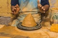 Mexican potter craftsman, working the clay with his hands