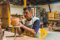 Mexican potter craftsman, working the clay with his hands